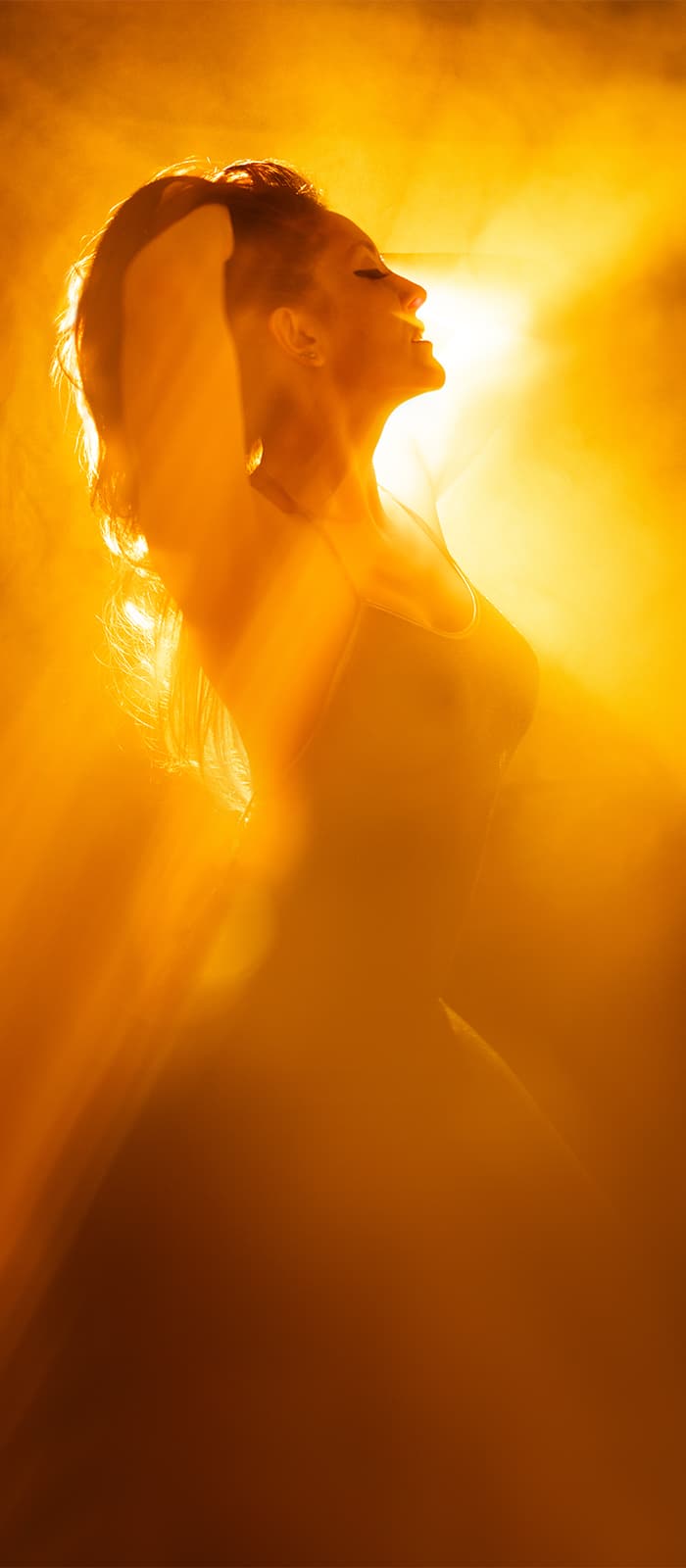 Woman Dancing in Light and Fog