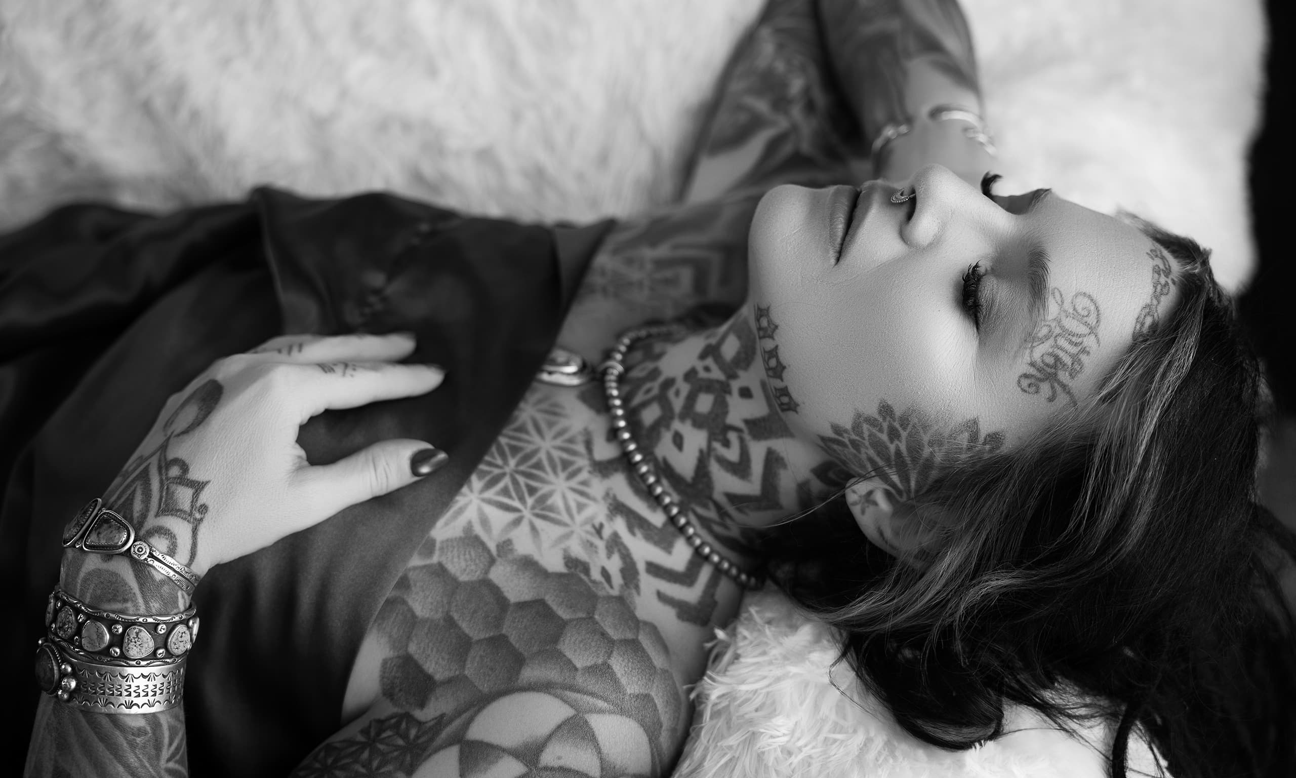 Woman with tattoos during a boudoir photography session in Denver, Colorado