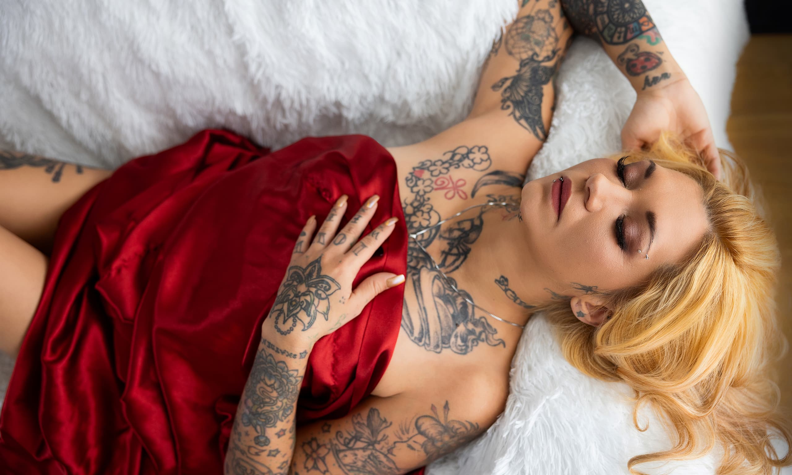Woman with tattoos during a boudoir photography session in Denver, Colorado